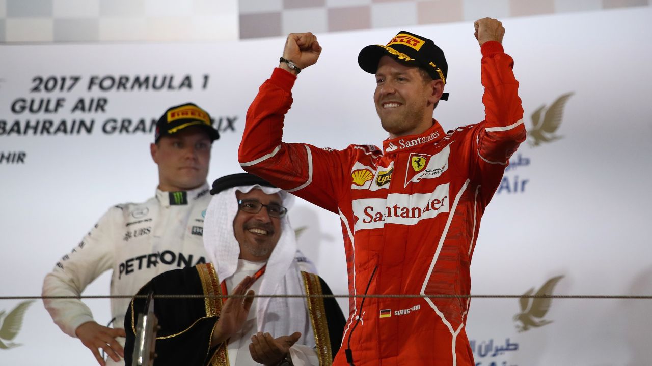 BAHRAIN, BAHRAIN - APRIL 16: Race winner Sebastian Vettel of Germany and Ferrari celebrates his win on the podium during the Bahrain Formula One Grand Prix at Bahrain International Circuit on April 16, 2017 in Bahrain, Bahrain. (Photo by Clive Mason/Getty Images)