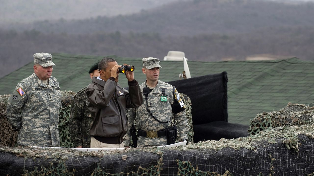US President Barack Obama looks toward North Korea from Observation Post Ouellette during a visit to the DMZ on March 25, 2012. Obama arrived in Seoul earlier in the day to attend the Seoul Nuclear Security Summit.