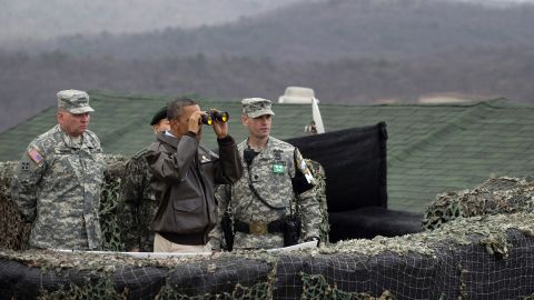 US President Barack Obama looks toward North Korea from Observation Post Ouellette during a visit to the DMZ on March 25, 2012. Obama arrived in Seoul earlier in the day to attend the Seoul Nuclear Security Summit.
