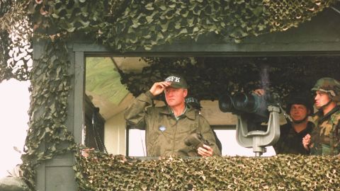 US President Bill Clinton surveys the North Korean border on his tour of the DMZ during a post-G7 summit trip in July 1993.