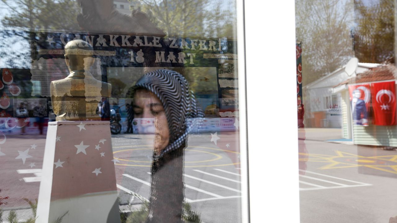 A woman prepares to cast her ballot at a polling center at a school in Ankara on Sunday.