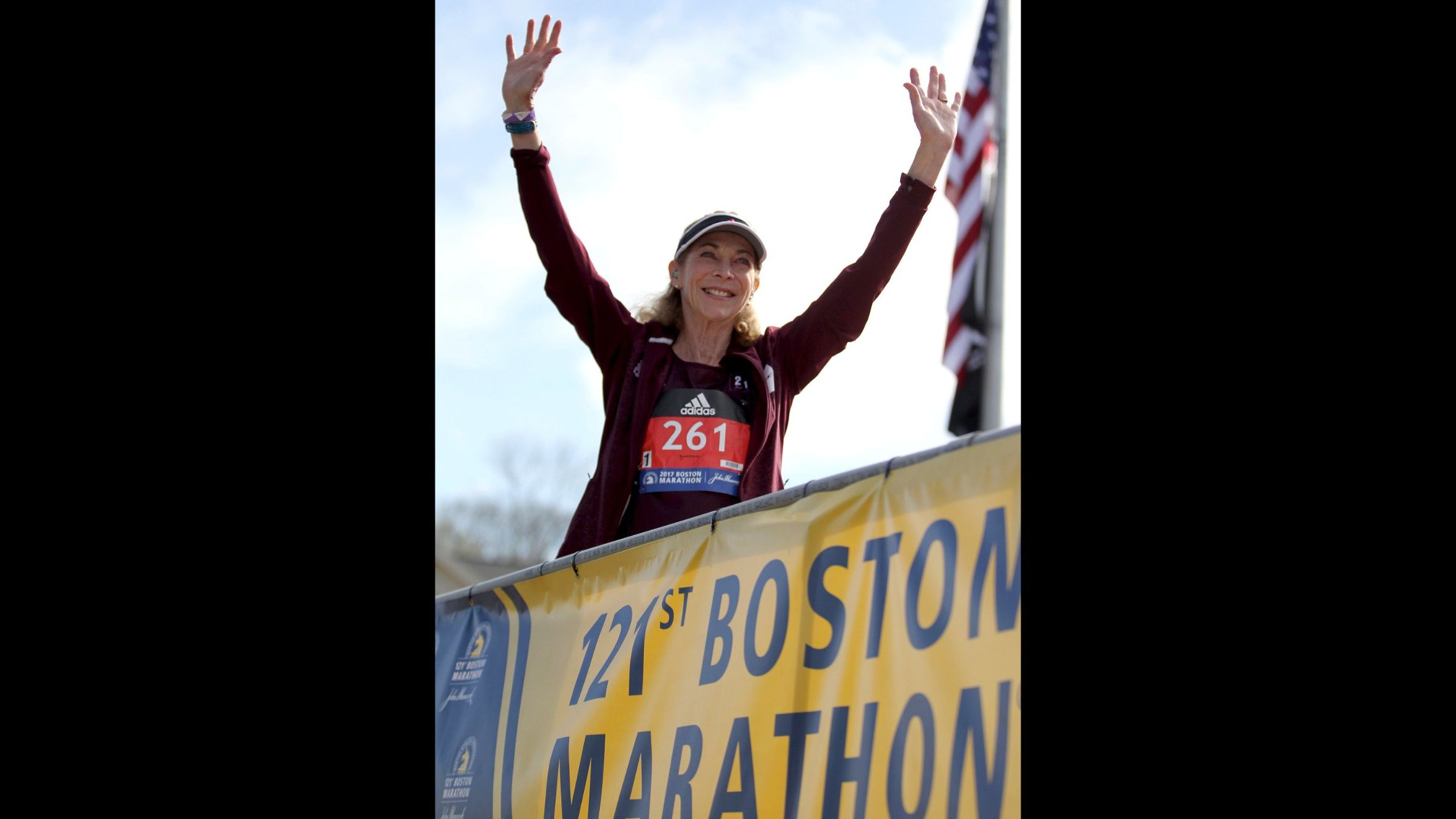 Switzer greets the Boston Marathon crowd Monday before the start of the women's elite division.
