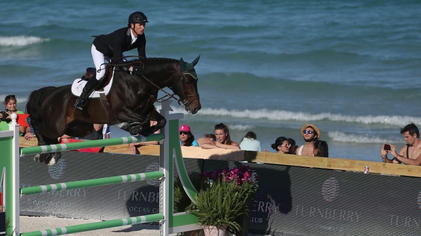MIAMI BEACH, FL - APRIL 03:  Richie Moloney jumps his horse over a hurdle during the Longines Global Champions Tour stop in Miami Beach on April 3, 2015 in Miami Beach, Florida. The tour, which visits locations around the world, brings together many of the top ranked show jumpers in the world to compete in prestigious locations for prize money.(Photo by Joe Raedle/Getty Images)
