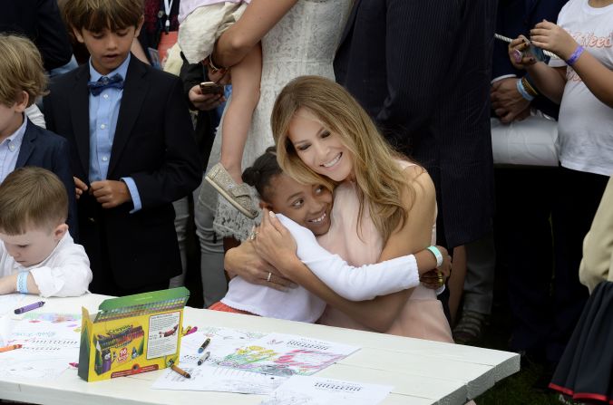 The first lady hugs a child at the annual <a href="index.php?page=&url=http%3A%2F%2Fwww.cnn.com%2F2017%2F04%2F17%2Fpolitics%2Fwhite-house-easter-egg-roll%2F" target="_blank">White House Easter Egg Roll</a> in April 2017. They were making cards for members of the US military.