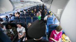 Captain Erich Ries shares travel tips during a "Wings for Autism" event at the airport in Atlanta.