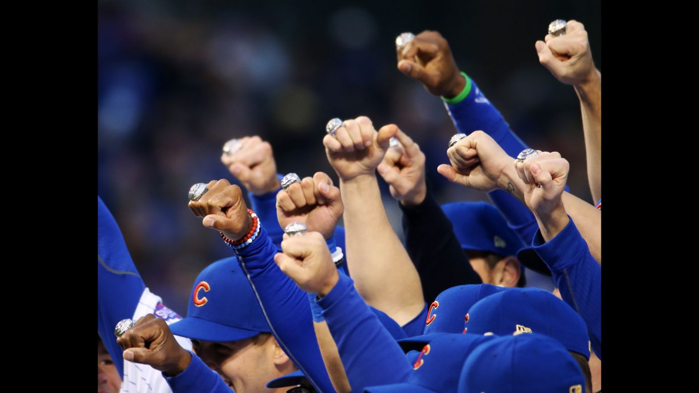 Chicago Cubs players pose with their World Series rings before a home game against Los Angeles on Wednesday, April 12. The ceremony Wednesday night commemorated Chicago's 2016 World Series win.