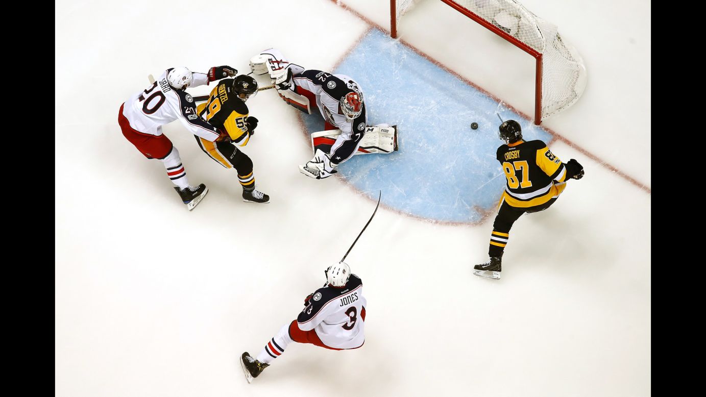 Sidney Crosby of Pittsburgh scores a goal past Columbus' Sergei Bobrovsky during an NHL Stanley Cup playoff game in Pittsburgh on Friday, April 14. Pittsburgh won 4-1.
