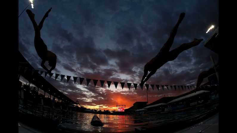 Trevor Carroll, left, and Kyler Van Swol compete in the 100-meter freestyle head C final in Mesa, Arizona, on Sunday, April 16.