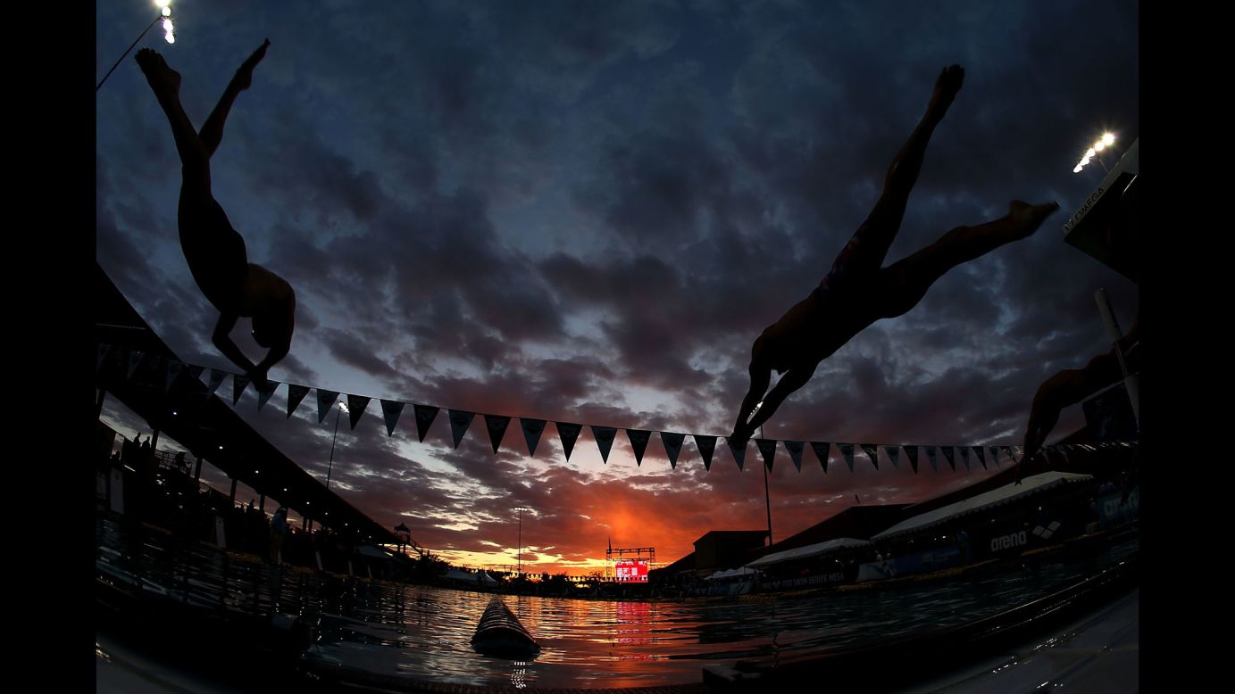 Trevor Carroll, left, and Kyler Van Swol compete in the 100-meter freestyle head C final in Mesa, Arizona, on Sunday, April 16.