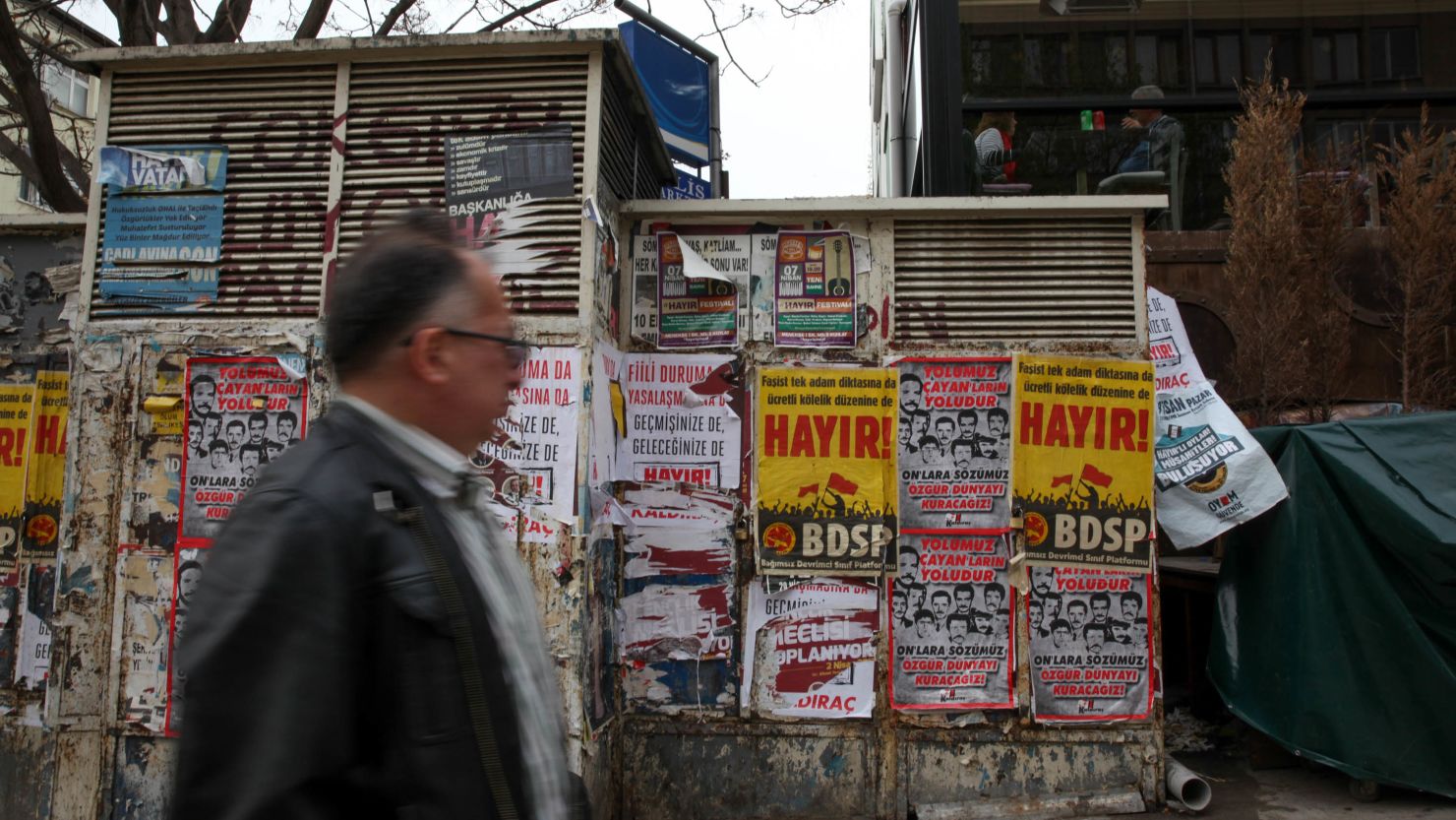 Residents walk past "Hayir" ("No") campaign posters in central Ankara on Monday.