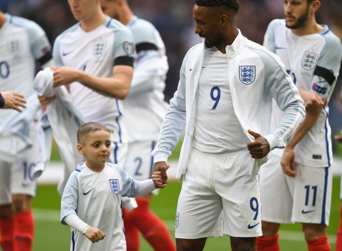 Defoe and Lowery line up prior to England's World Cup qualifier against Lithuania.