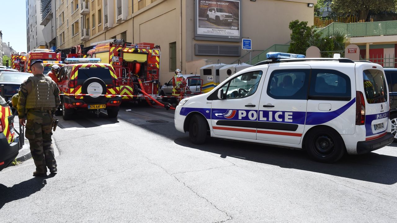 A French soldier, police and firefighters vehicles are seen at the site of a police search at the home of one of the two men arrested, as they were suspected of preparing an attack just days ahead of the first round of France's presidential vote on April 18, 2017 in the third district of Marseille.
The suspects, aged 23 and 29, were taken into custody by French domestic intelligence service agents in the southern city of Marseille, a source close to the probe said.