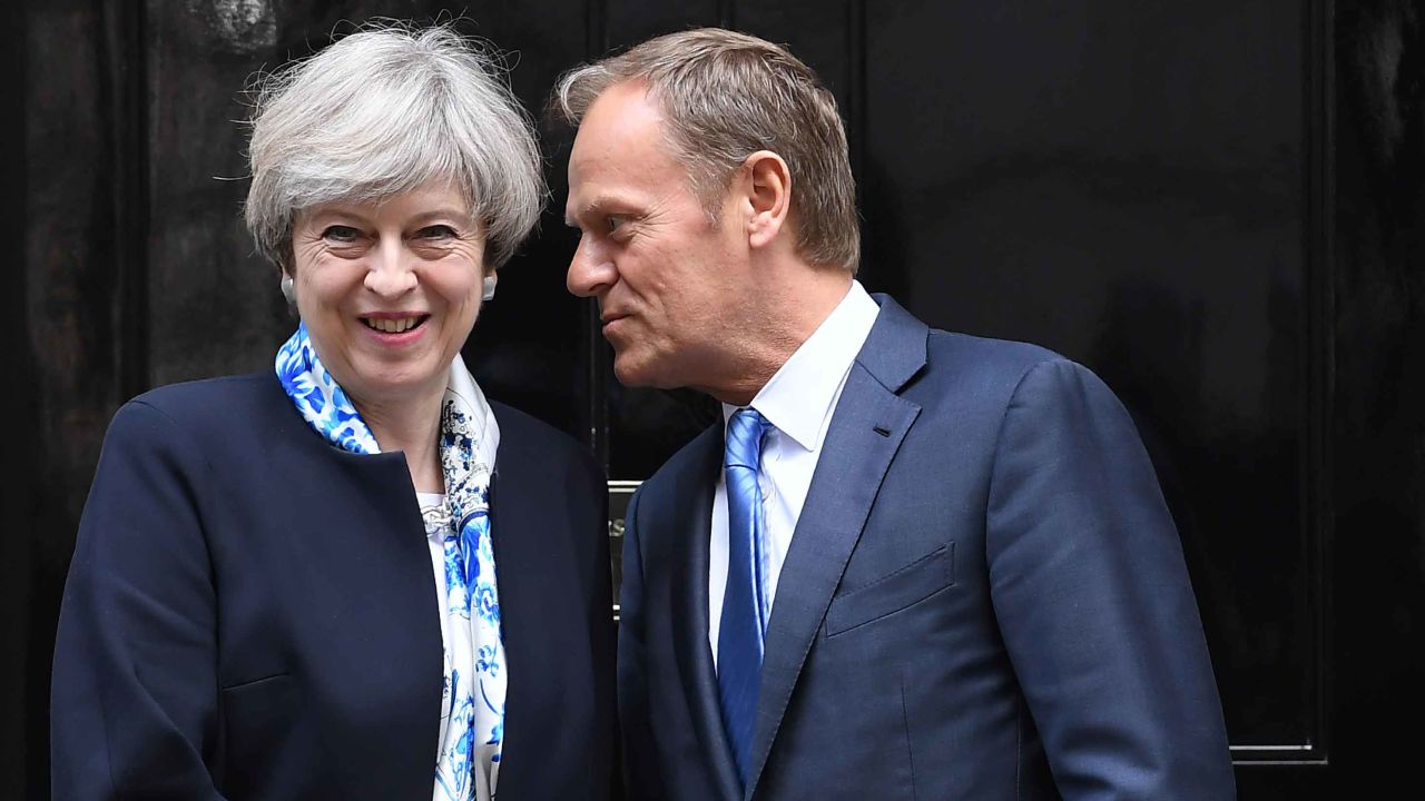British Prime Minister Theresa May, left, greets European Council President Donald Tusk outside 10 Downing street in central London on April 6.