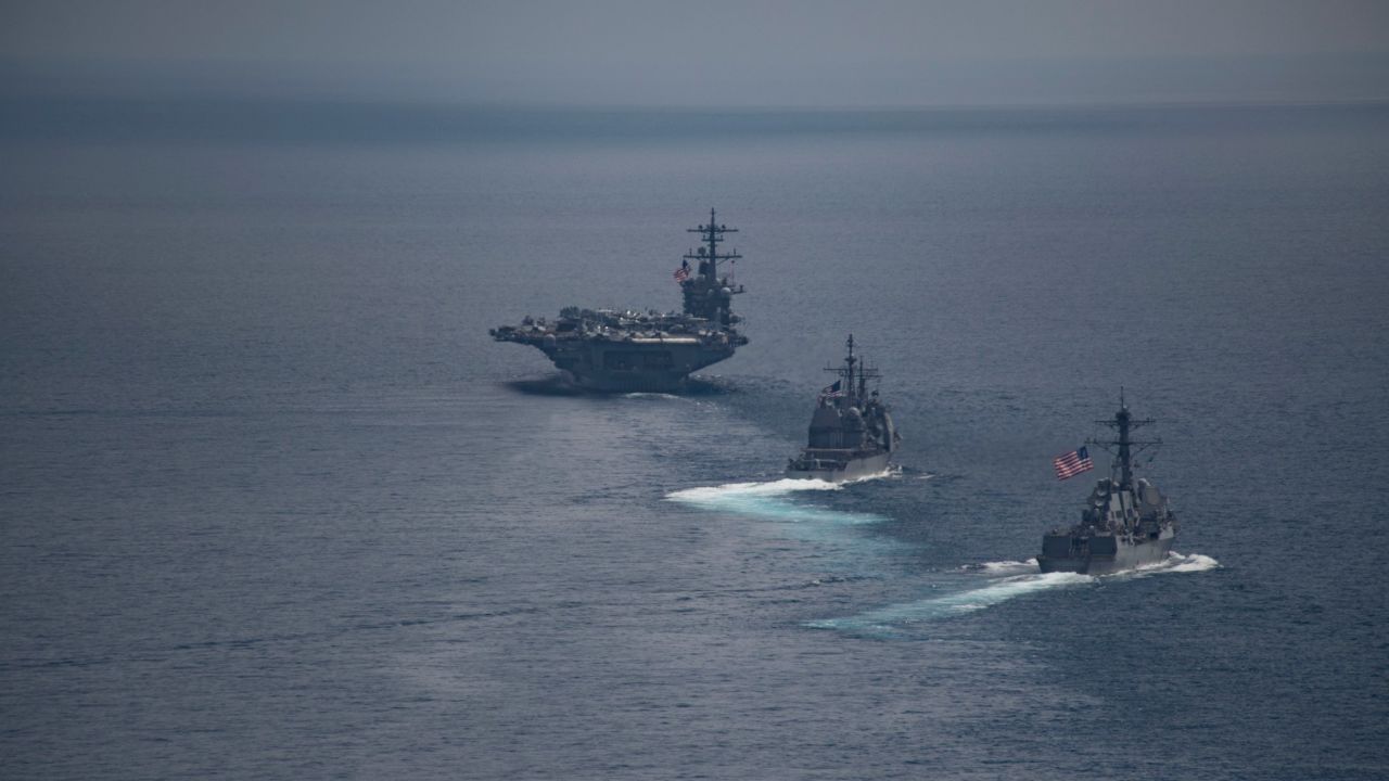 The aircraft carrier USS Carl Vinson leads the guided-missile destroyer USS Michael Murphy and the guided-missile cruiser USS Lake Champlain in the Indian Ocean on April 14.