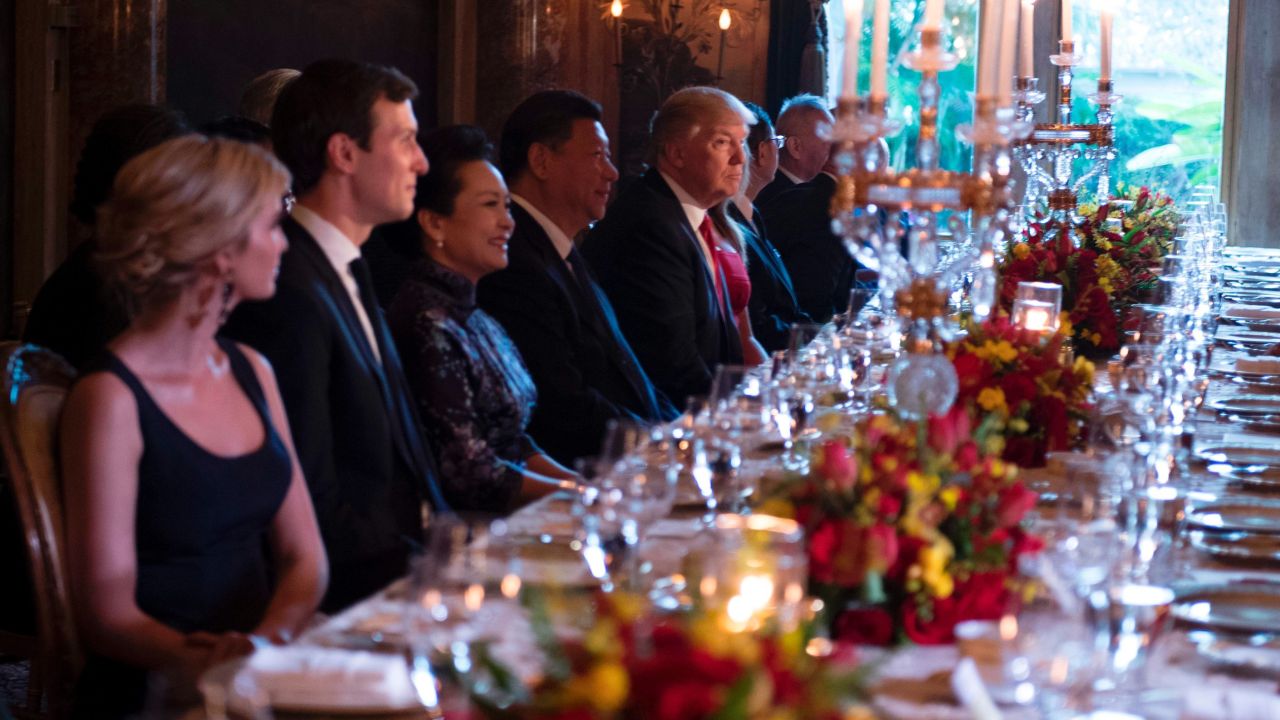 TOPSHOT - US President Donald Trump (C) and Chinese President Xi Jinping (L) look on during dinner at the Mar-a-Lago estate in West Palm Beach, Florida, on April 6, 2017. / AFP PHOTO / JIM WATSON        (Photo credit should read JIM WATSON/AFP/Getty Images)