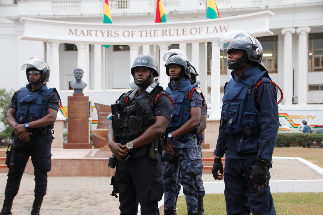 Policemen stand guard in front of Ghana's Supreme Court on August 29 in Accra.