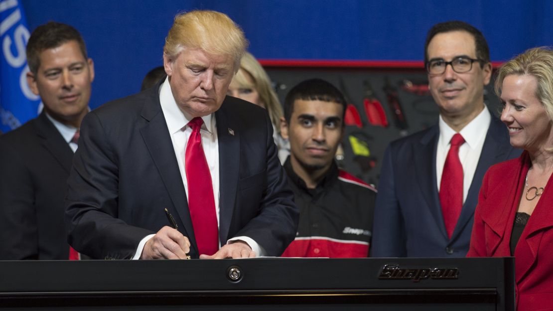 US President Donald Trump signs a Buy American, Hire American Executive Order at Snap-On Tools in Kenosha, Wisconsin, April 18, 2017.