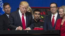 US President Donald Trump signs a Buy American, Hire American Executive Order at Snap-On Tools in Kenosha, Wisconsin, April 18, 2017. / AFP PHOTO / SAUL LOEB        (Photo credit should read SAUL LOEB/AFP/Getty Images)