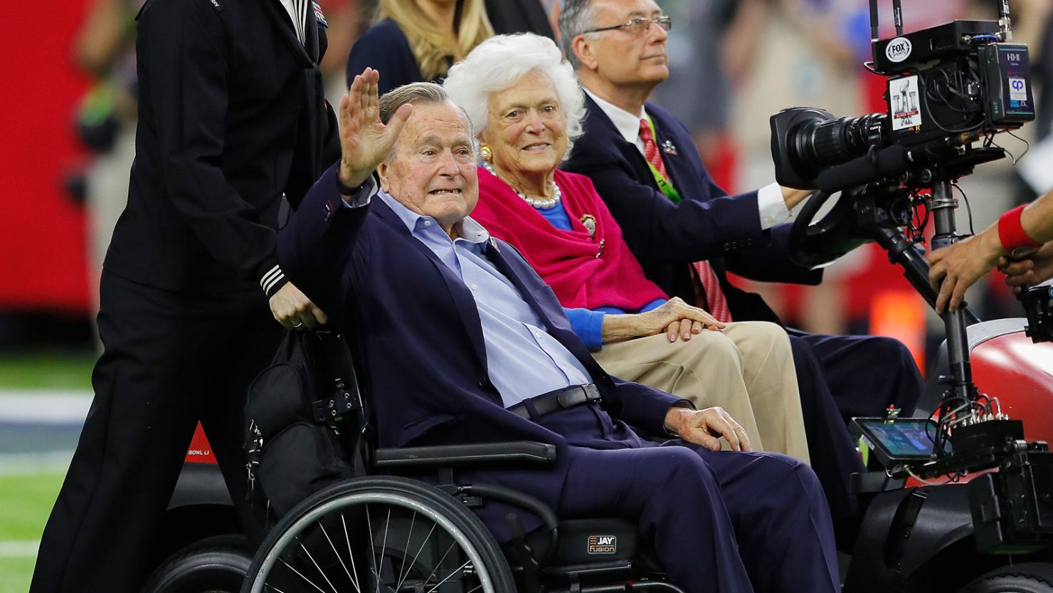 Former President George H.W. Bush and Barbara Bush arrive for the coin toss prior to Super Bowl 51 between the Atlanta Falcons and the New England Patriots at NRG Stadium on February 5, 2017, in Houston. 