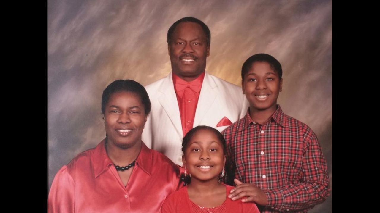 Kwasi Enin (far right), around 12 years old, with his sister, mother Doreen (far left), and father Ebenezer. "He had friends who would come around, and they would go to the beach and have fun. So he had a complete life," Ebenezer said about his son's childhood.