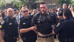A protestor is arrested after a fight at Auburn University's Foy Hall on Tuesday, April 18. 