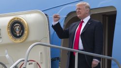 US President Donald Trump disembarks from Air Force One upon arrival at General Mitchell International Airport in Milwaukee, Wisconsin, April 18, 2017, as he travels to Kenosha, Wisconsin, to speak at Snap-On Tools. 