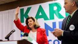 Republican candidate for Georgia's Sixth Congressional seat Karen Handel waves after speaking at an election night watch party with husband Steve, right, in Roswell, Ga., Tuesday, April 18, 2017. Republicans are bidding to prevent a major upset in a conservative Georgia congressional district Tuesday where Democrats stoked by opposition to President Donald Trump have rallied behind a candidate who has raised a shocking amount of money for a special election. (AP Photo/David Goldman)