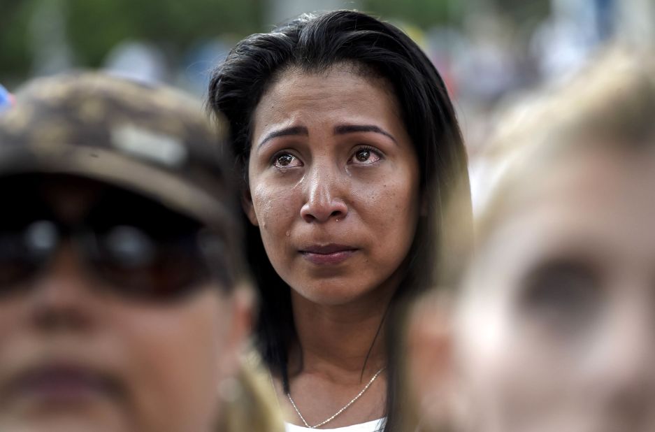 A demonstrator reacts during a march in Caracas on Saturday, April 15.