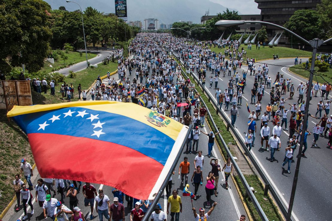 Thousands of people rally against Venezuelan President Nicolas Maduro along the Francisco Fajardo highway in eastern Caracas.
