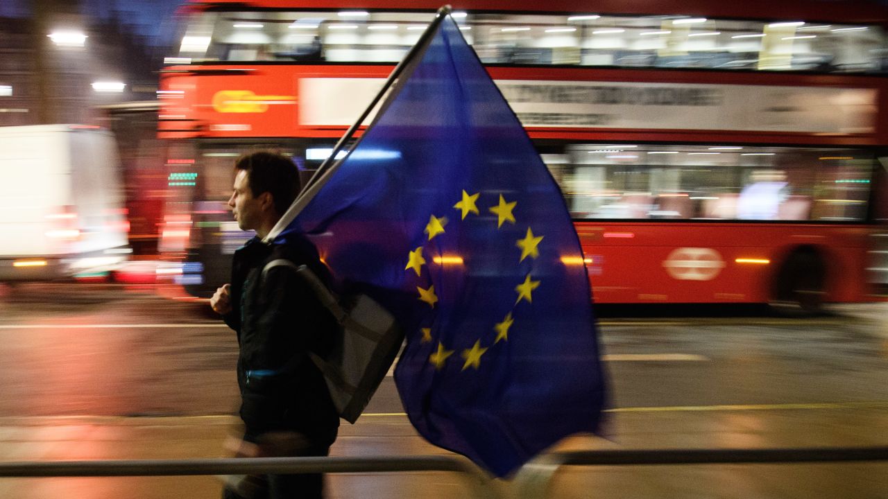 LONDON, ENGLAND - JANUARY 24: A man carries a European Union flag outside the Supreme Court in Parliament Square ahead of the ruling on whether Parliament have the power to begin the Brexit process, on January 24, 2017 in London, England. The judgement will play an important role in how the Government proceeds with it's planned use of the EU's Article 50 exit clause. (Photo by Leon Neal/Getty Images)