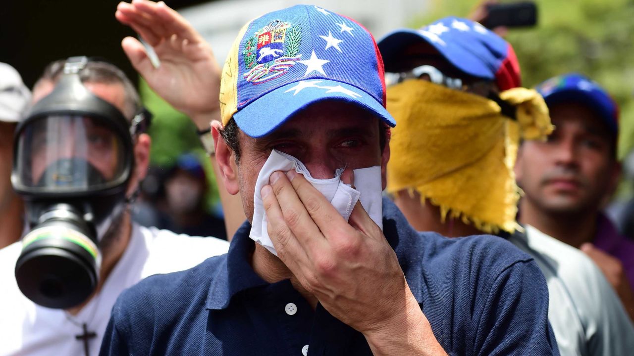 Opposition leader Henrique Capriles suffers the effects of tear gas during a Wednesday rally in Caracas.