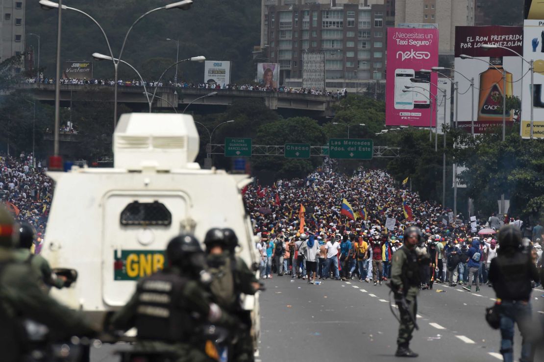 Riot police confront demonstrators during an anti-government rally Wednesday in Caracas.