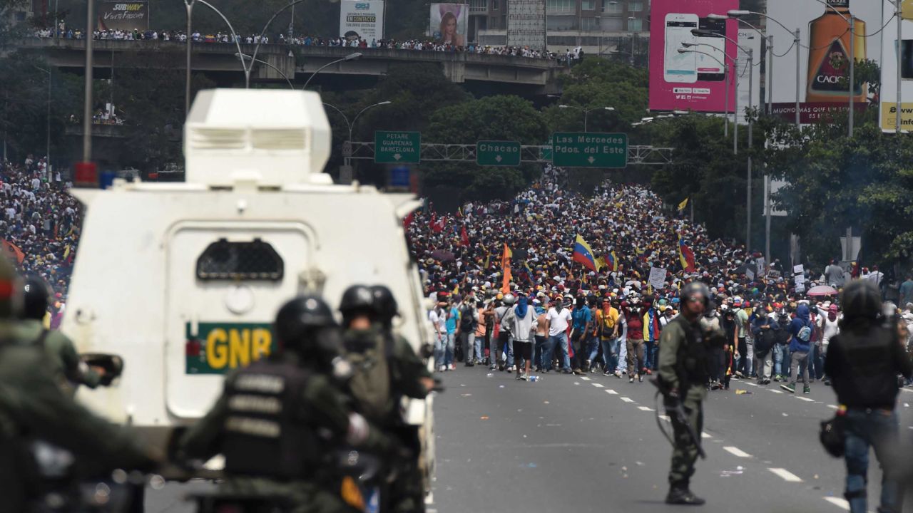 Riot police confront demonstrators during an anti-government rally Wednesday in Caracas.