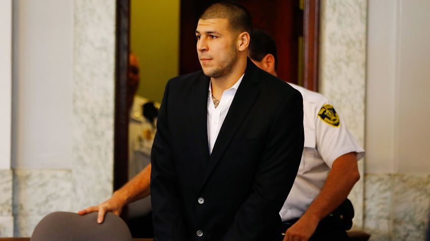 NORTH ATTLEBORO, MA - AUGUST 22: Aaron Hernandez is escorted into the courtroom of the Attleboro District Court for his hearing on August 22, 2013 in North Attleboro, Massachusetts. Former New England Patriot Aaron Hernandez has been indicted on a first-degree murder charge for the death of Odin Lloyd. (Photo by Jared Wickerham/Getty Images)