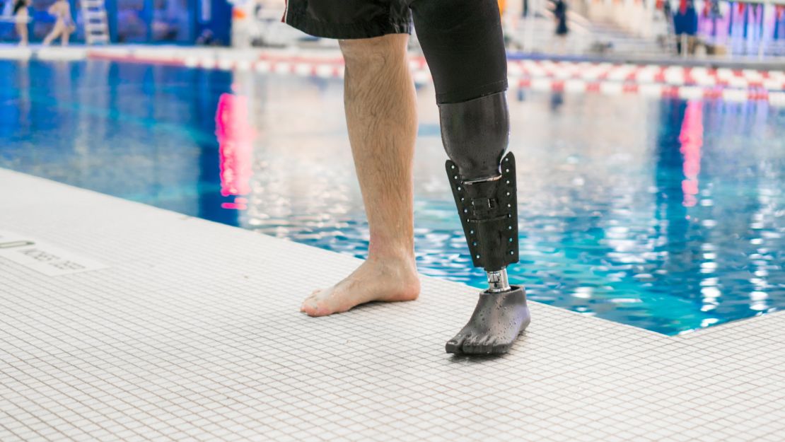 The Fin attaches to a standard prosthetic, allowing the swimmer to enter and exit the water without changing prosthetics.
