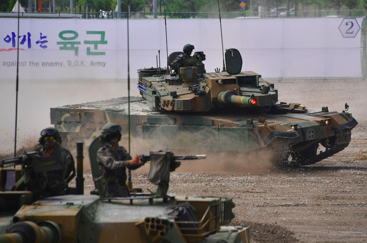 <strong>A South Korean K2 tank (C) moves during an equipment demonstration at the Defense Expo Korea 2016 at KINTEX exhibition hall in Goyang, north of Seoul, on September 10, 2016. The K2, nicknamed the "Black Panther" is considered to be among the world's best tanks.</strong>