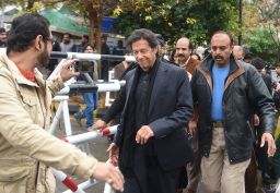 Pakistani opposition leader Imran Khan (center) leaves the Supreme Court in January.