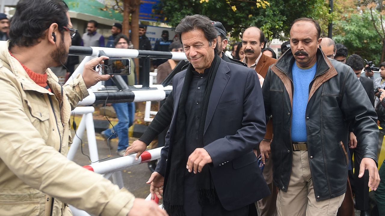 Pakistani opposition leader Imran Khan (center) leaves the Supreme Court in January.
