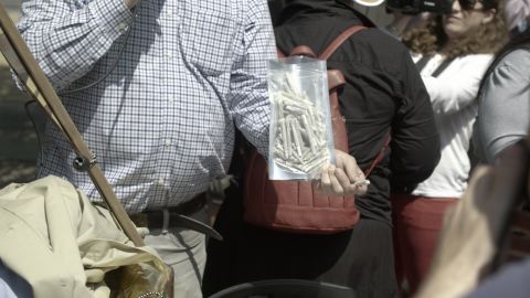 DCMJ co-founder Adam Eidinger holds a bag of joints prior to being arrested.