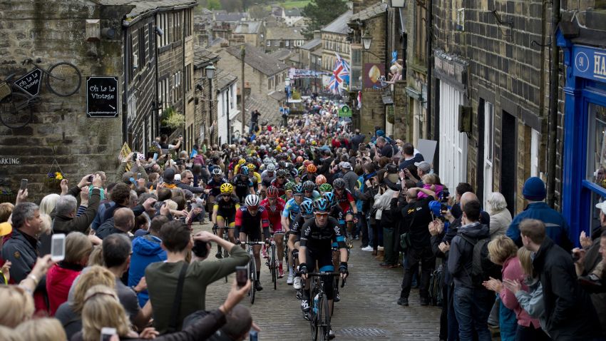 Cylists ride on a cobblestone street through the village of Haworth as they take part on the third and final day of the inaugural 'Tour de Yorkshire' in Haworth on May 3, 2015. 
 AFP PHOTO / OLI SCARFF        (Photo credit should read OLI SCARFF/AFP/Getty Images)