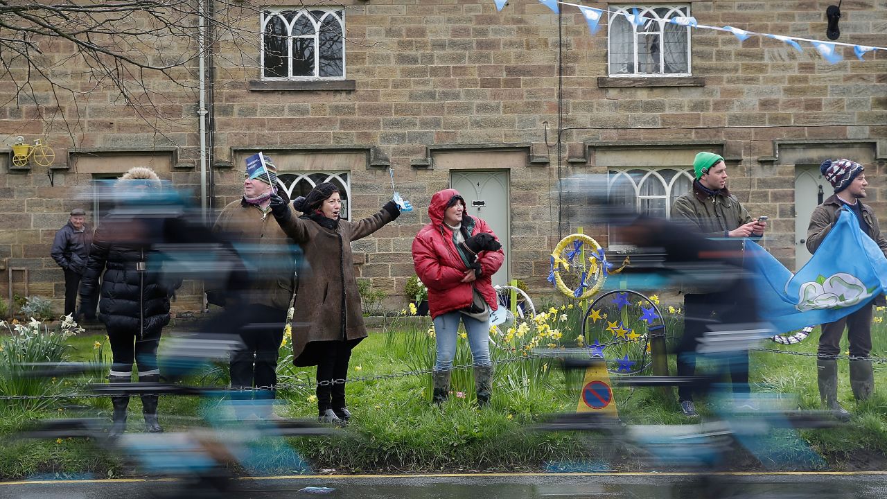 Spectators line the main street of Ripley as the riders of the Tour De Yorkshire cycle race pass through the village.