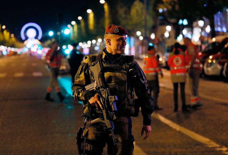 A French soldier stands guard after the shooting.