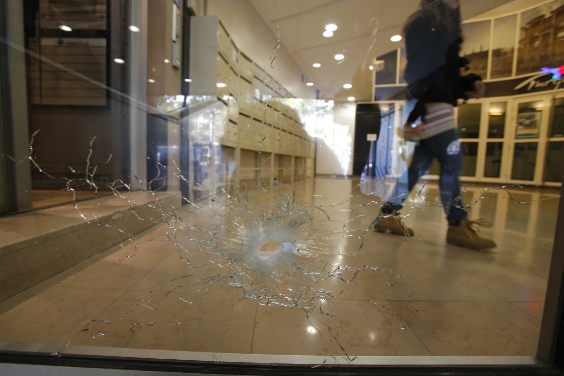 A damaged window is pictured on the Champs Elysees boulevard in Paris early Friday.