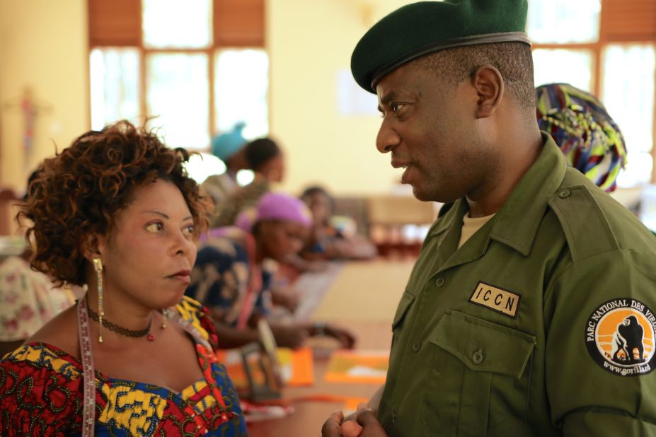 In 2013, Katembo was arrested and held for 17 days. He believes it was because days prior to his arrest he had attempted to stop construction of a communication device in the park. Public outrage led to his release.<br /><br />Pictured here, Katembo meets with a group of widows whose husbands are among the park rangers killed in the line of duty, often at the hands of armed rebels and poachers.