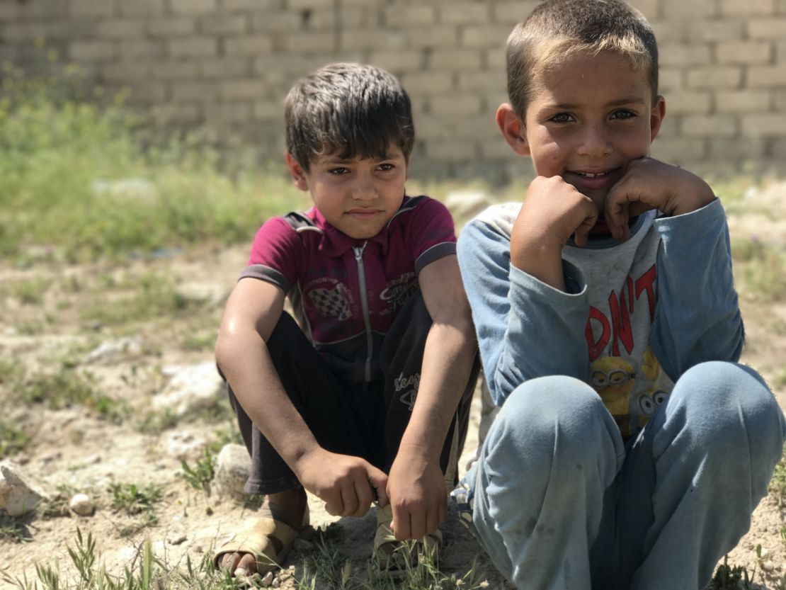 Children who fled the fighting in western Mosul waiting at a collection point for displaced families.  