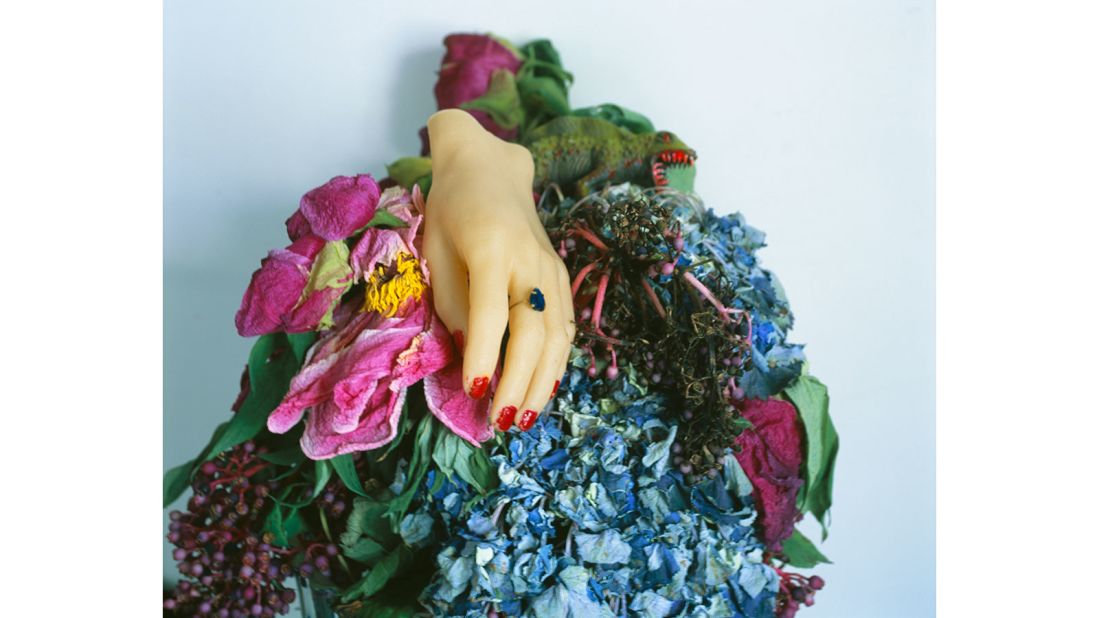 Nobuyoshi Araki's personal collection of figurines are combined with flowers and potted plants to create these compositions.