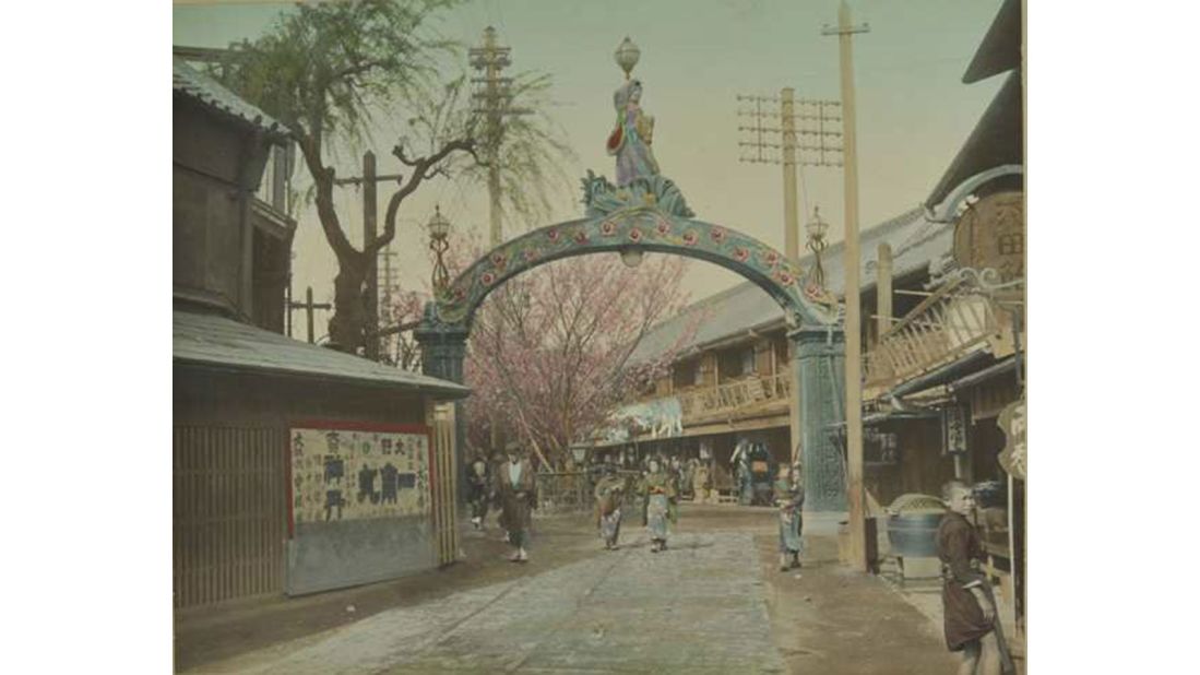 An old photo of the entrance to the pleasure quarter of Yoshiwara, Tokyo, where visitors could be entertained by courtesans, kabuki theater, restaurants and tea houses.
