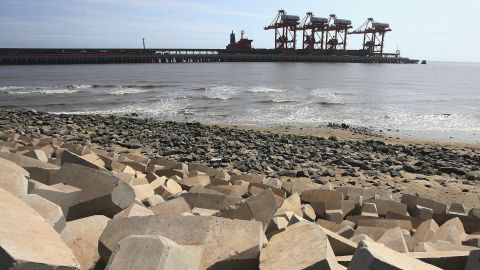 TANGSHAN, CHINA - JULY 19: (CHINA OUT) A view of a wharf at Caofeidian Port on July 19, 2006 in Tangshan of Hebei Province, China. Caofeidian Port will be developed as the biggest deep water port, coal transportation center and steel production base in northern China. July 28 will mark the 30th anniversary of Tangshan Earthquake. On July 28, 1976, the devastating magnitude 7.8 earthquake hit Tangshan, killing over 240,000 people and destroying 93 per cent of residential buildings, the disaster was the deadliest of the 20th century. In the 30 years, China has spent over 10 billion yuan (USD 1.25 billion) to rebuild the industrial city and Tangshan has entered China's top 20 cities in terms of overall strength, according to state media. (Photo by China Photos/Getty Images)