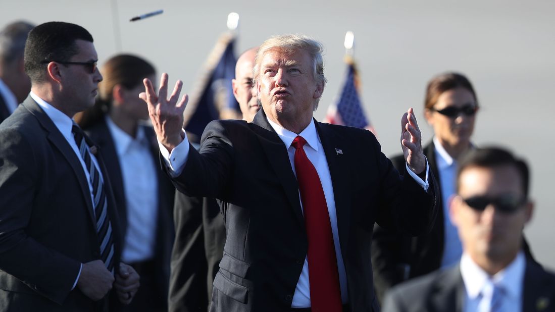 Trump tosses a Sharpie pen back to a group of supporters after signing autographs in Palm Beach, Florida, on Friday, February 3. Trump was spending the weekend at his Mar-a-Lago resort, which has become <a href="http://www.cnn.com/2017/04/14/politics/donald-trump-north-korea-mar-a-lago/" target="_blank">a popular trip</a> so far during his presidency.