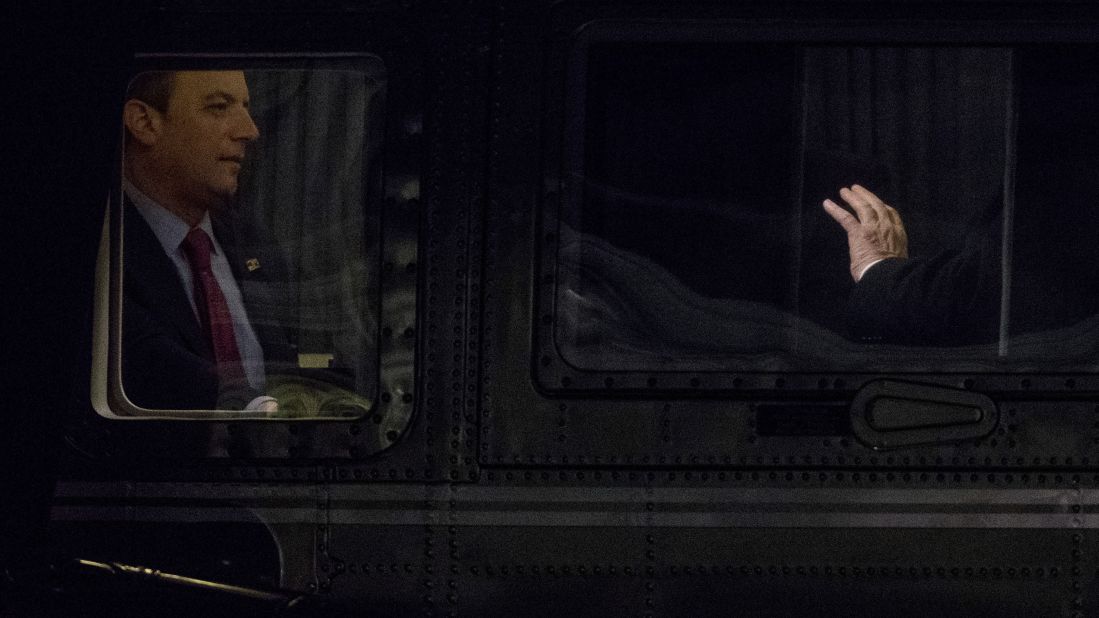 White House Chief of Staff Reince Priebus, left, listens to Trump as Marine One lands on the South Lawn of the White House on Monday, February 20. Prior to joining the Trump administration, Priebus was chairman of the Republican National Committee.